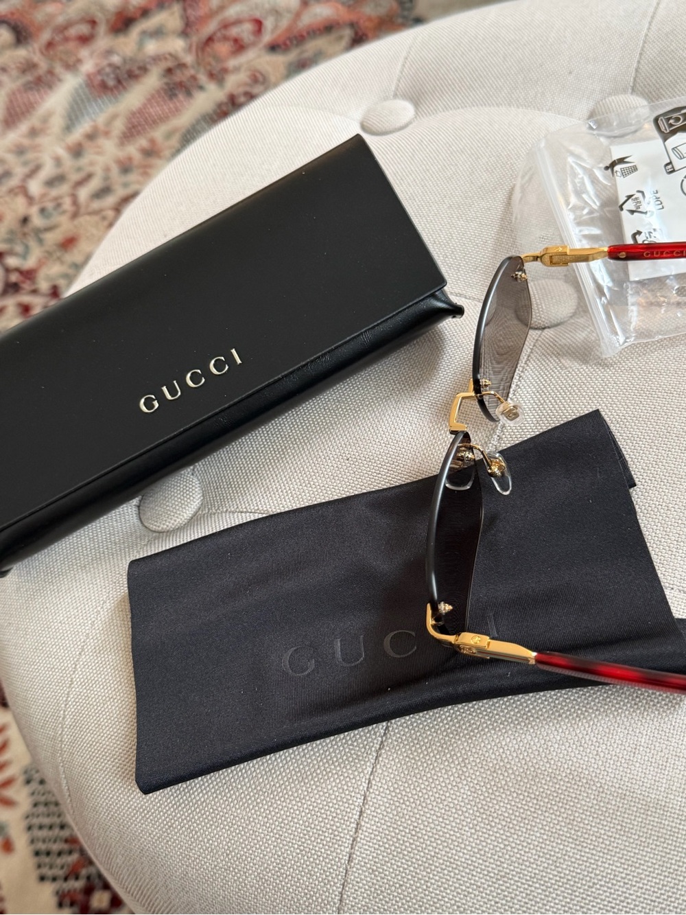 Gucci Men's Rimless Sunglasses with Black Lenses and Red Temples